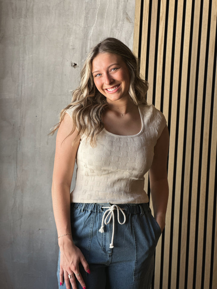 Front view of model wearing a textured Knit Square Neck Cap Sleeve Tee in cream