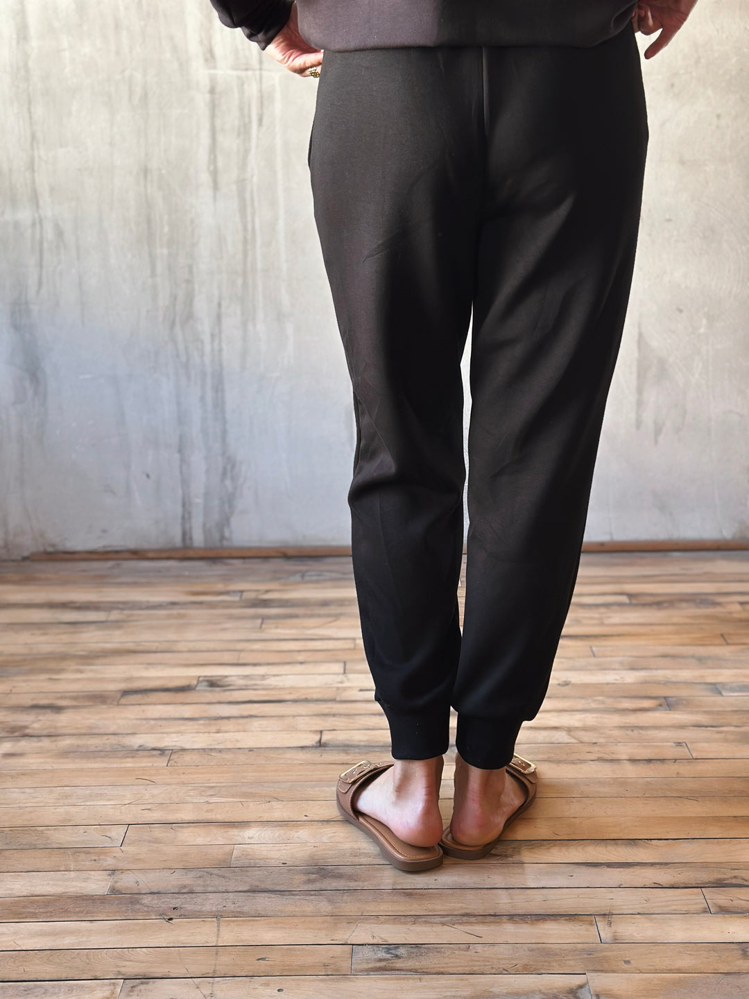 back view of elastic ankle, drawstring waist, and side pockets, they offer a relaxed yet polished vibe