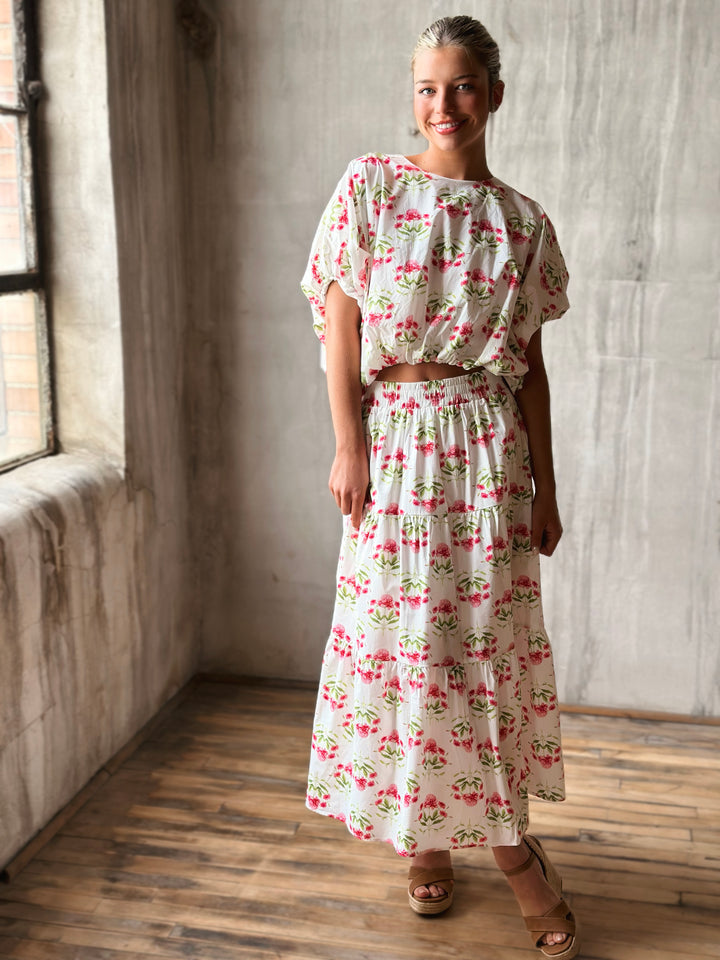Full Front of floral print midi skirt features a high-rise, elasticated waistband and matching top