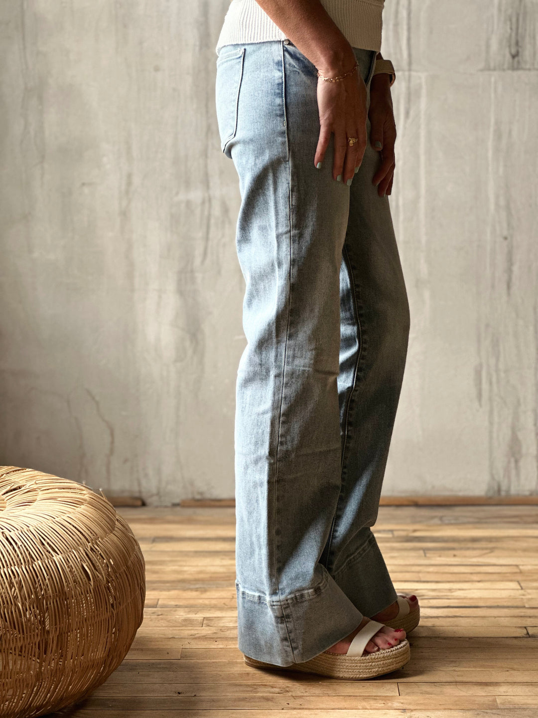 Side view of model wearing High-Rise Super Stretch Trouser Wide Leg Jeans