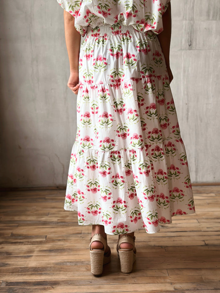 Back of floral print midi skirt features a high-rise, elasticated waistband