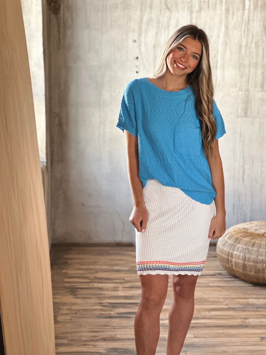 Front view of ULTRA LIGHTWEIGHT LINED KNIT SKIRT WITH RAINBOW STRIPED HEMLINE