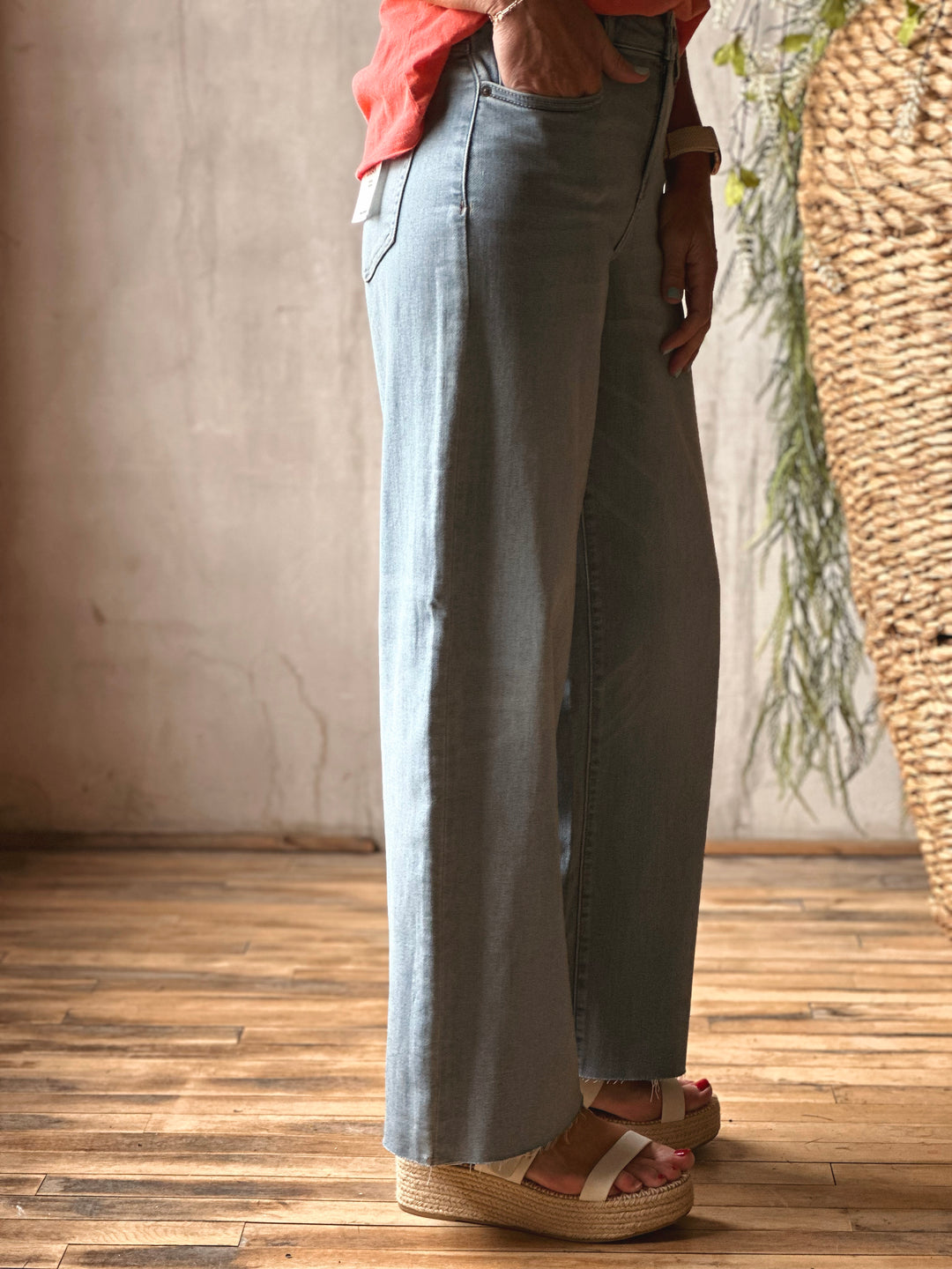 Side view of model wearing Mid-Rise Dad Fit Basic Jeans by Hidden, featured in a vintage wash