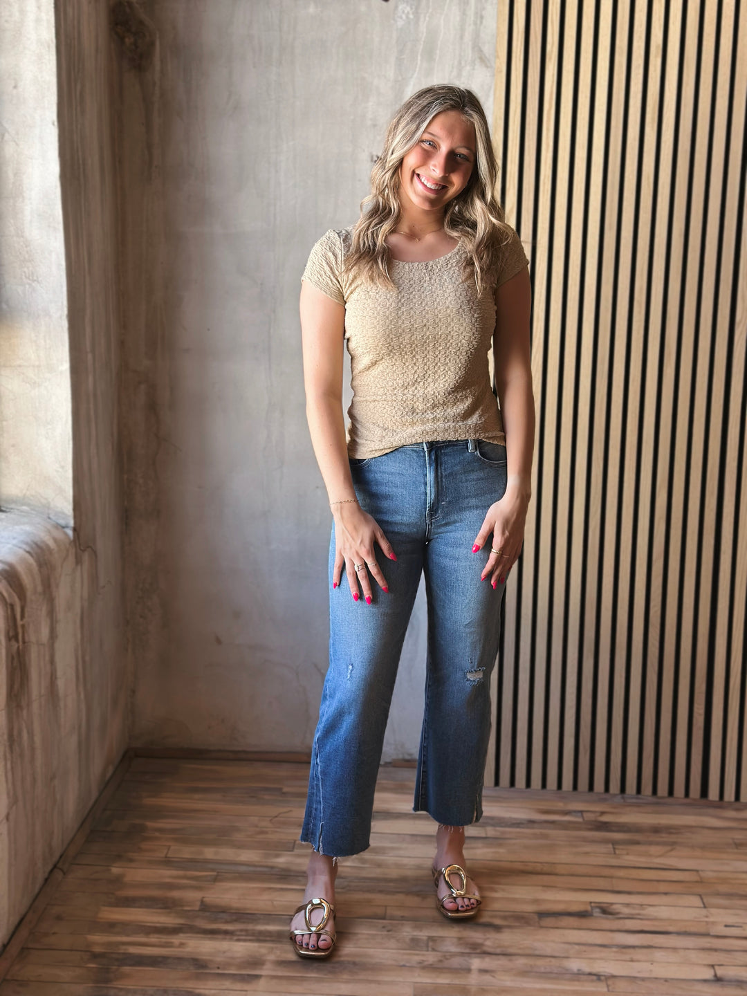 Front view of model wearing Popcorn Textured Knit Double Scoop Neckline Cap Sleeve Top in the color sand