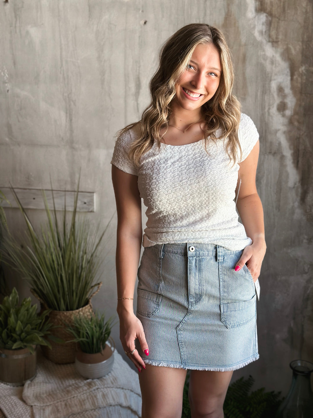Front view of model wearing Popcorn Textured Knit Double Scoop Neckline Cap Sleeve Top in the color white