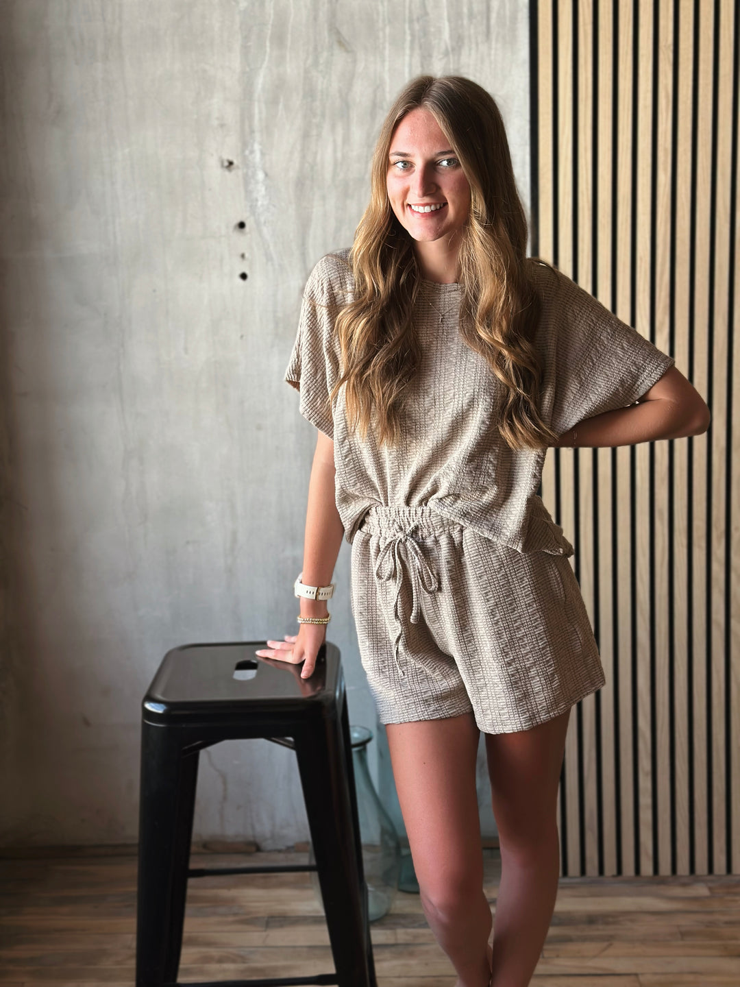 Front view of model wearing textured knit top & shorts set with elastic waist in the color taupe