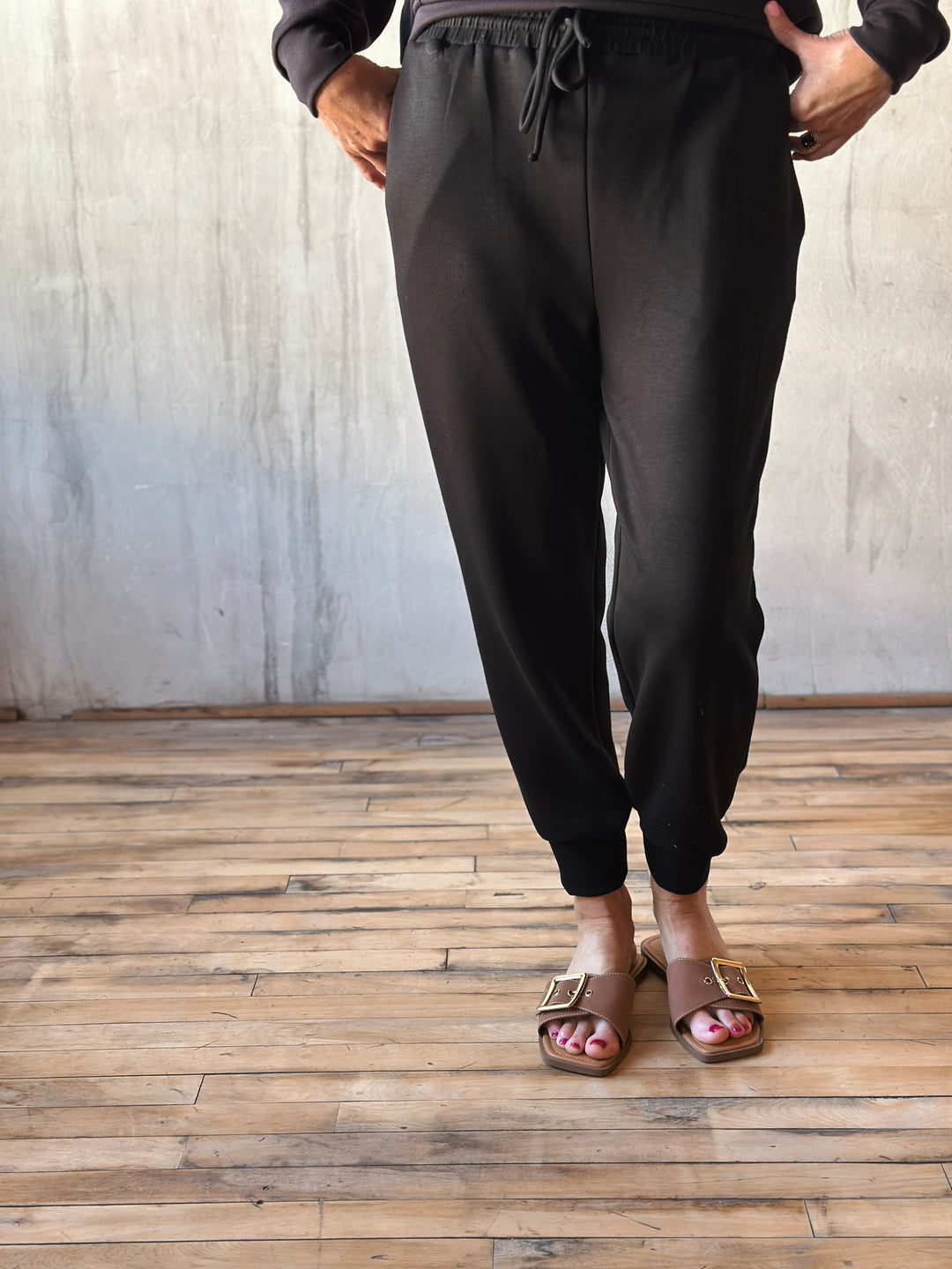 Front view of elastic ankle, drawstring waist, and side pockets, they offer a relaxed yet polished vibe