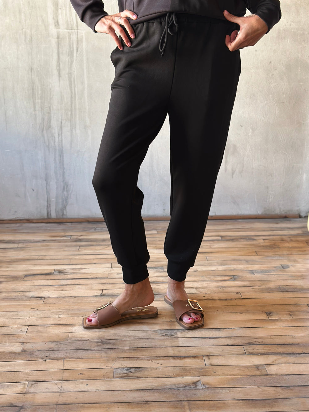 Front view of elastic ankle, drawstring waist, and side pockets, they offer a relaxed yet polished vibe