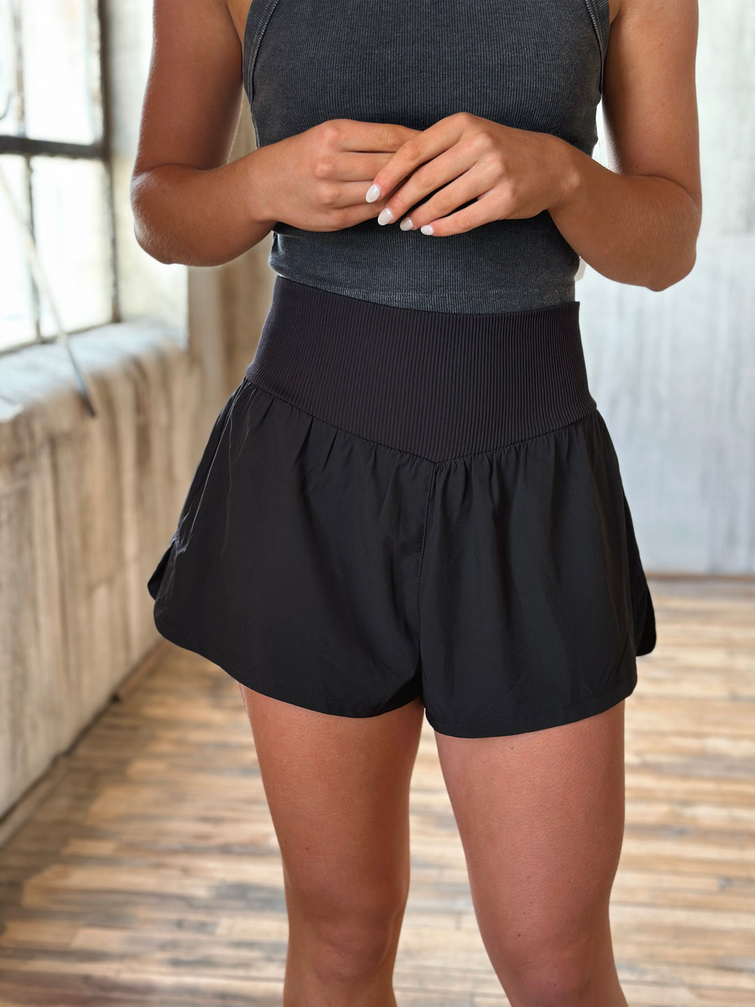 Front view Air Flow Ribbed Waist Athletic Shorts – in black