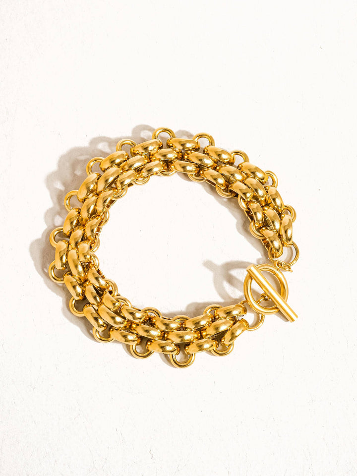 Gold chain bracelet on a white background