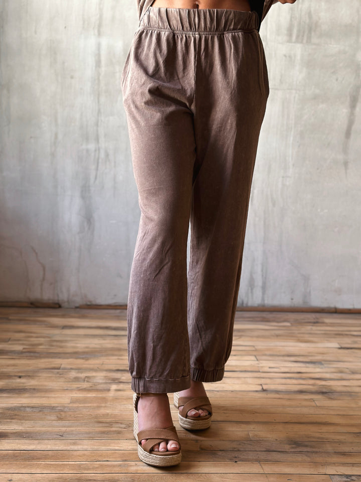 front view mineral washed pants ankle length are paired with an elastic waistband and half-cinched hem in mocha