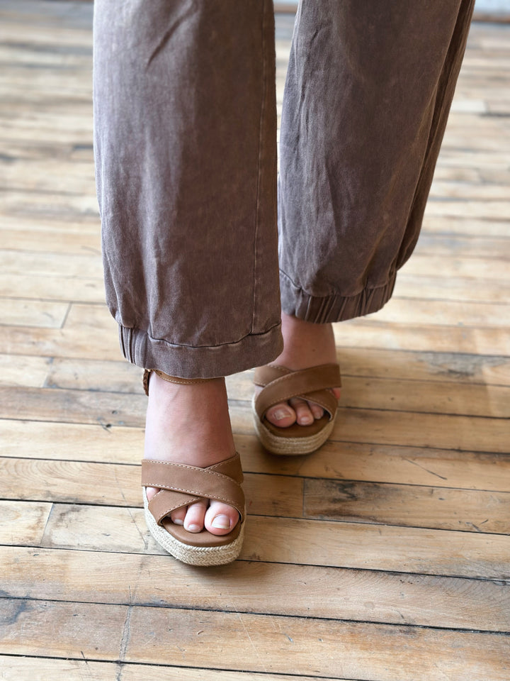 front ankle view mineral washed pants ankle length are paired with an elastic waistband and half-cinched hem in mocha
