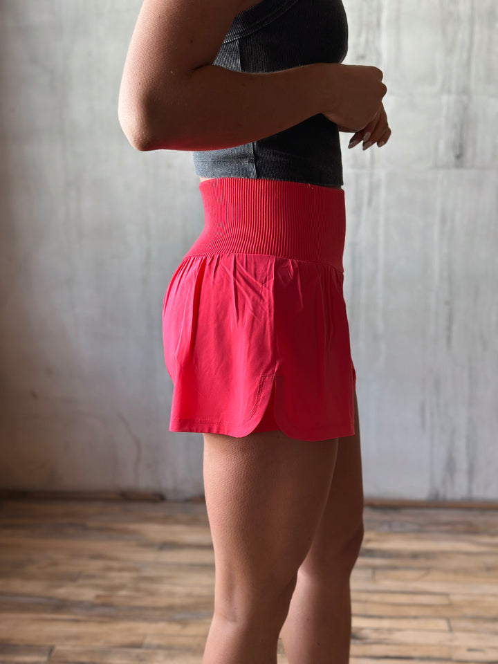 side view Air Flow Ribbed Waist Athletic Shorts – in Coral