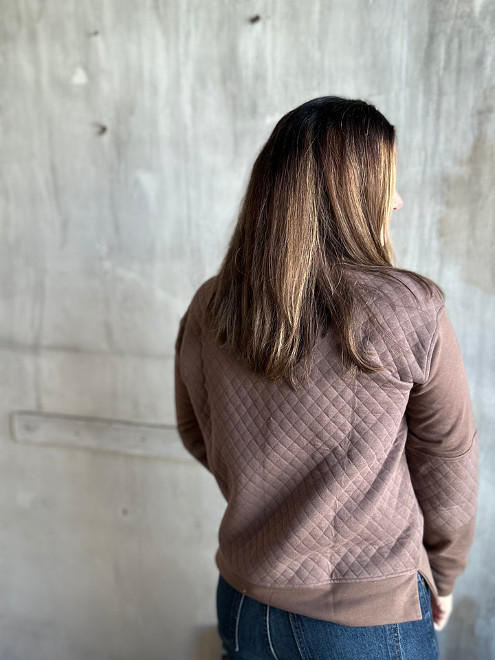 Back view of a mocha brown quilted pullover