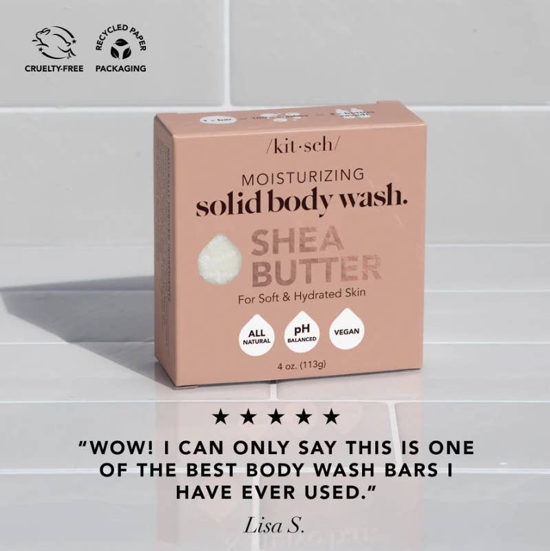 Kit-sch Shea Butter solid body wash bar on a tiled surface with a customer review quote.