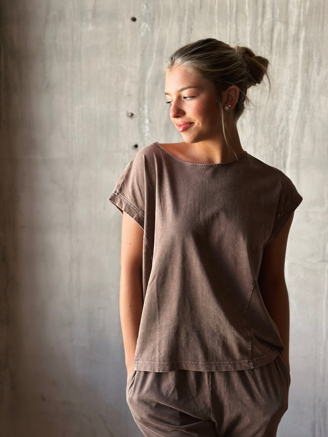 front view of relaxed, oversized fit with dropped shoulders and a high-low hem. mineral washed in mocha