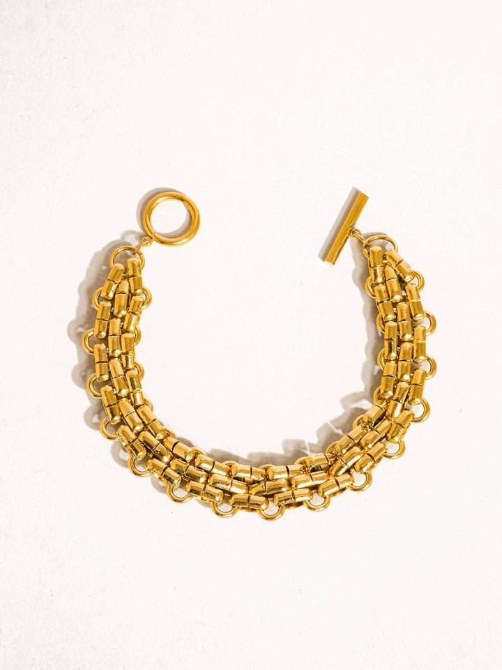 Gold chain bracelet on a white background