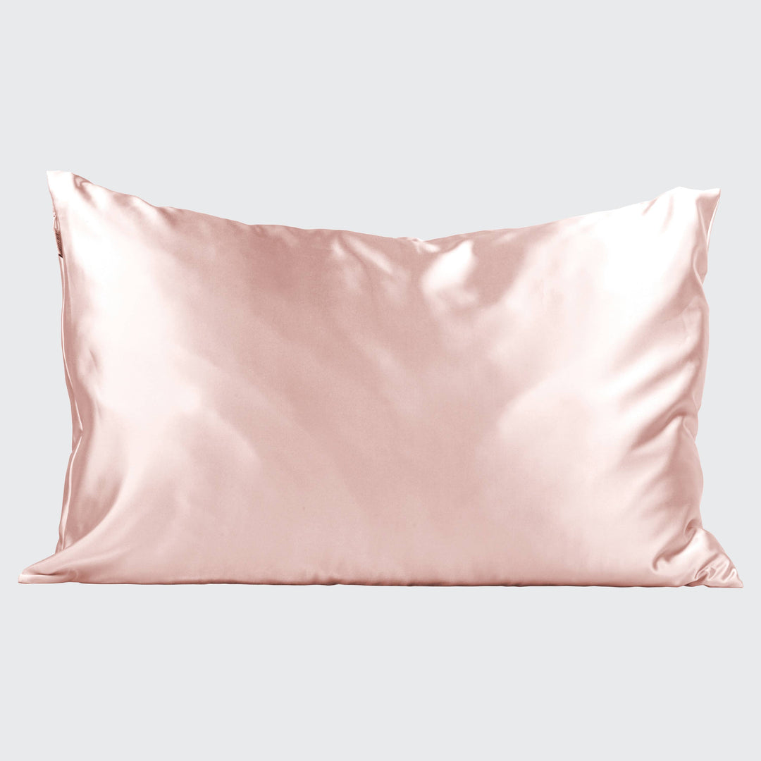 Silky pink pillowcase on a light gray background