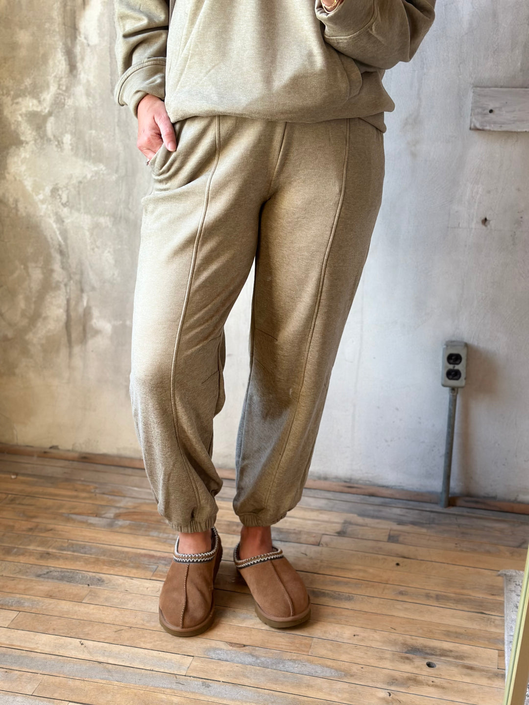 Khaki jogger pants with a relaxed fit, front view