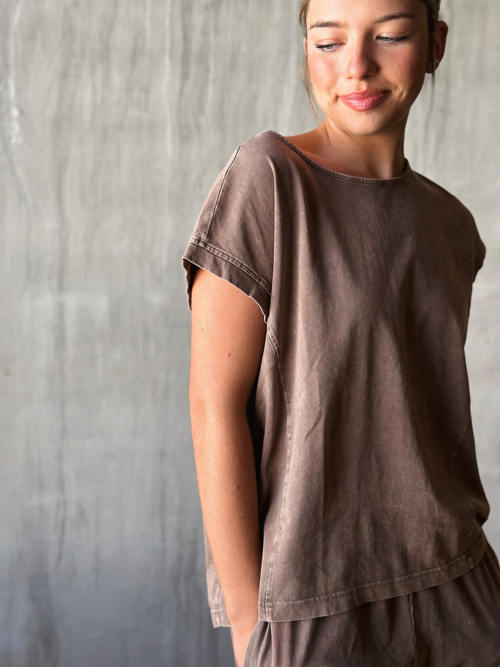 front view of relaxed, oversized fit with dropped shoulders and a high-low hem. mineral washed in mocha