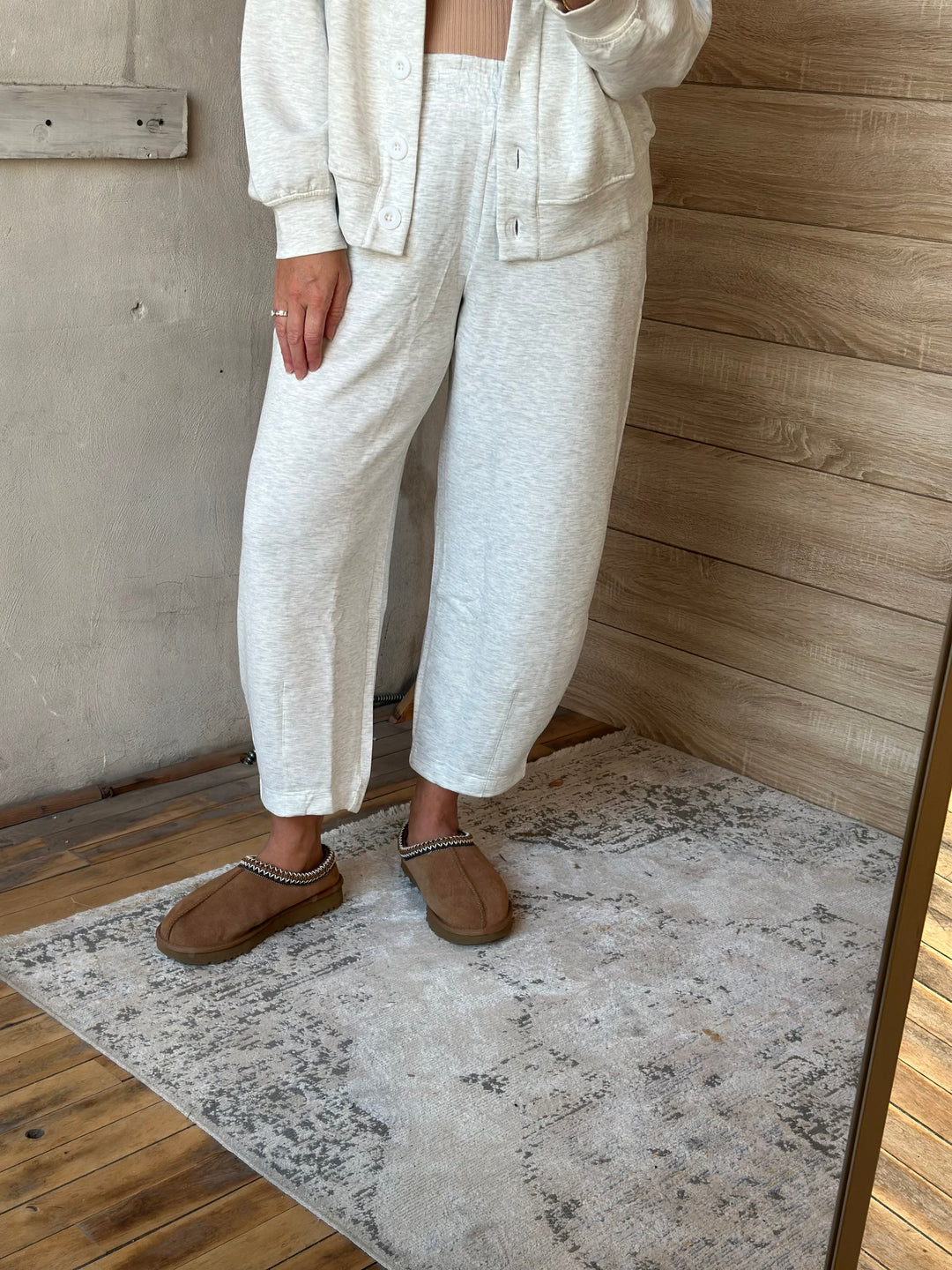 Cream barrel-leg pants, side view
