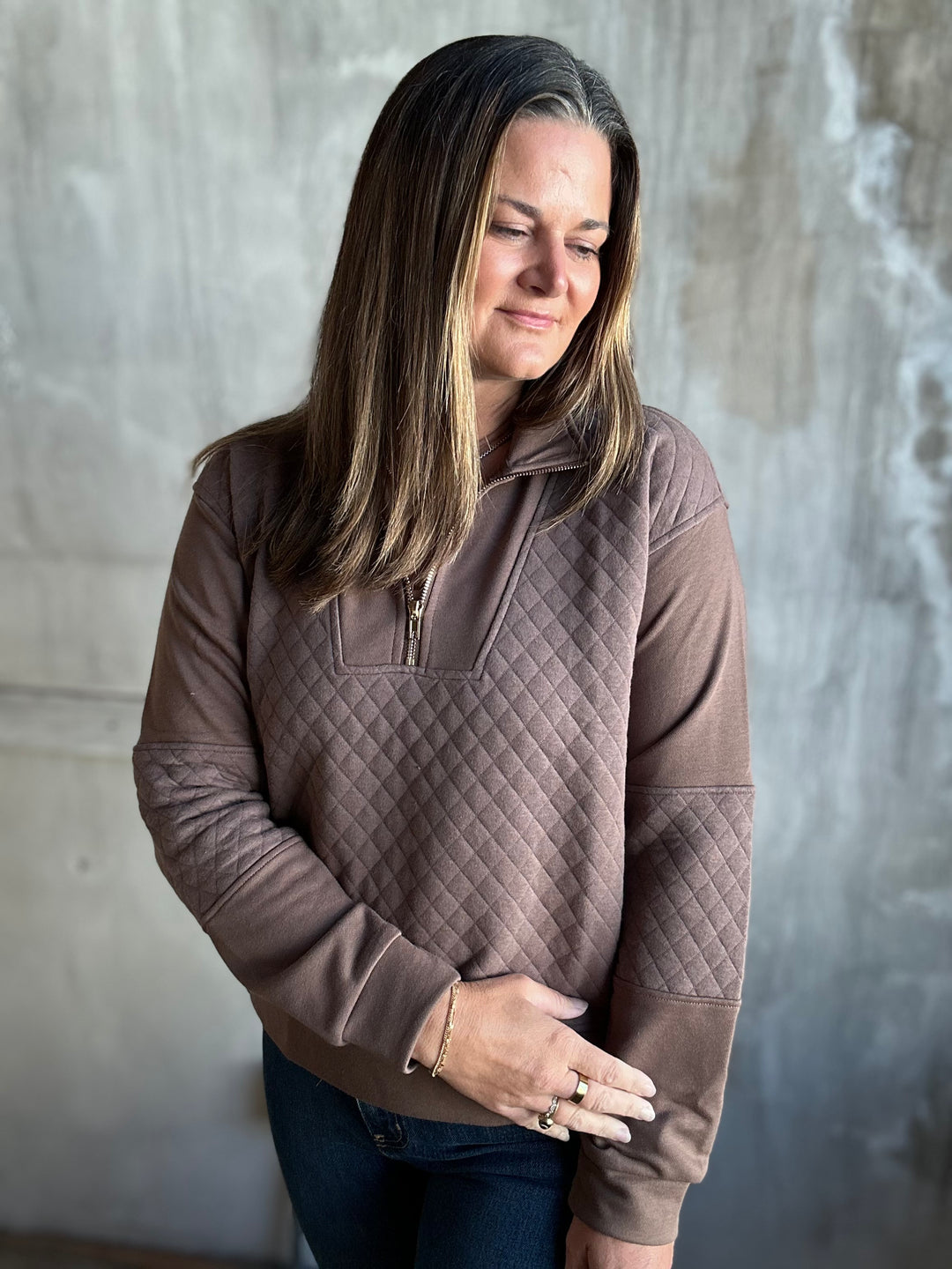 Mocha brown quilted half-zip pullover, angled view