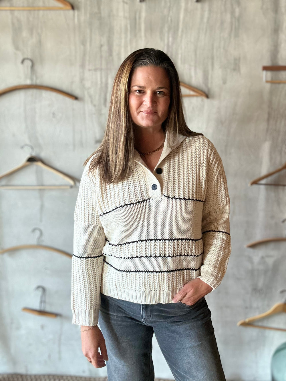 Cream textured-knit collared sweater with black stripes, front view