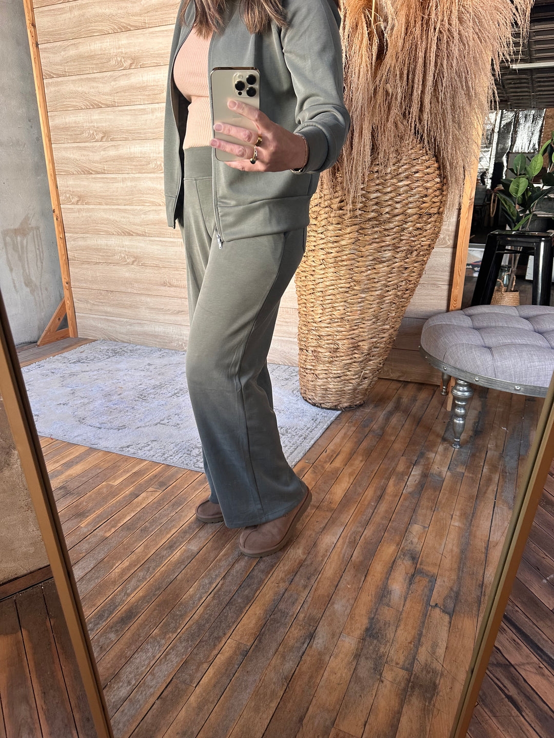Olive green wide-leg pants shown in a full-length mirror photo