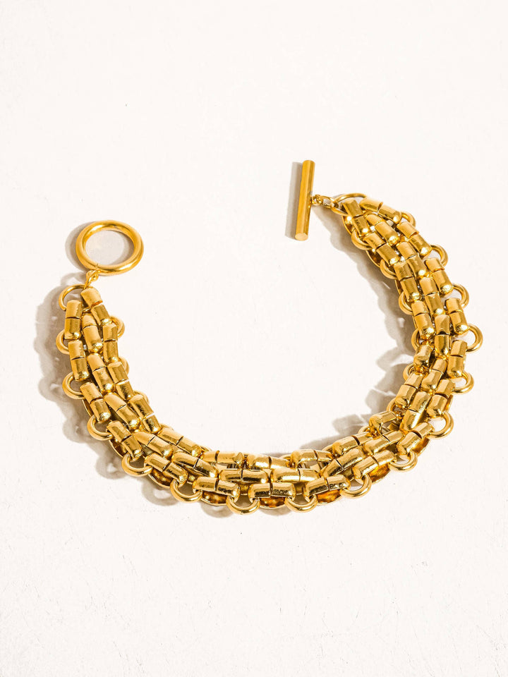 Gold chain bracelet on a white background