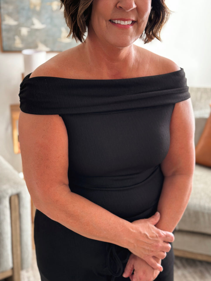 Woman wearing a black off-shoulder set