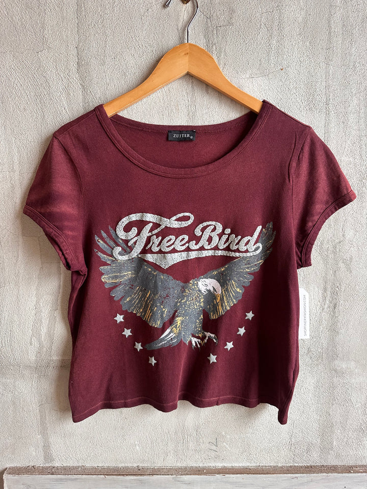 Burgundy Free Bird eagle graphic tee on a hanger