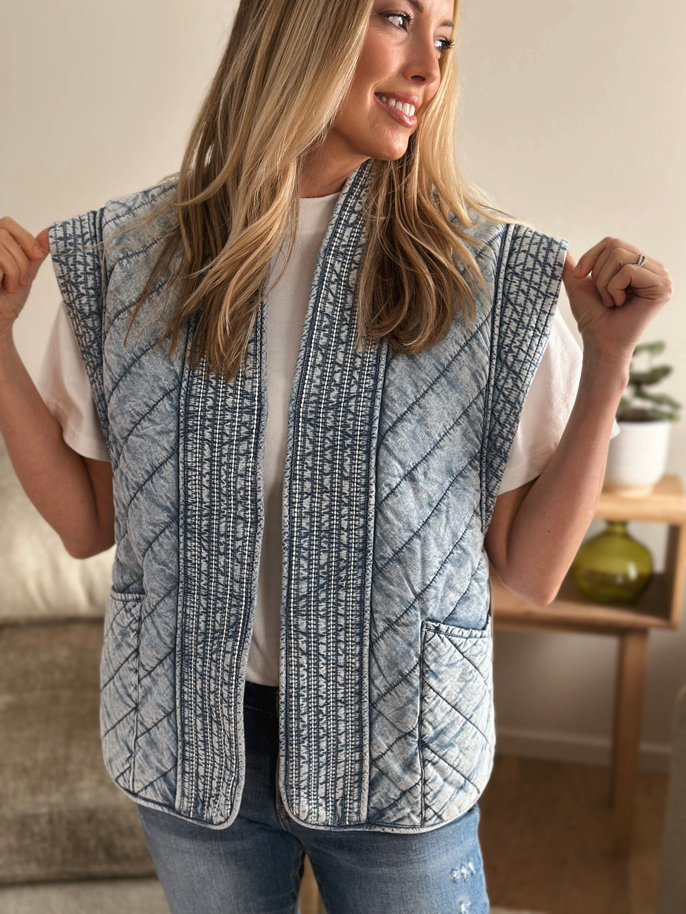 Woman wearing a quilted vest indoors