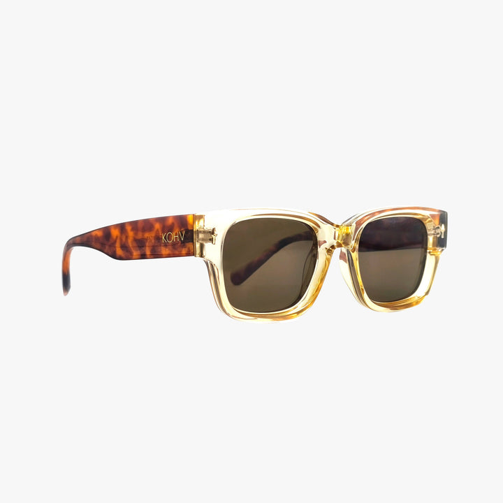 Sunglasses with tortoiseshell frame and gold accents on a white background
