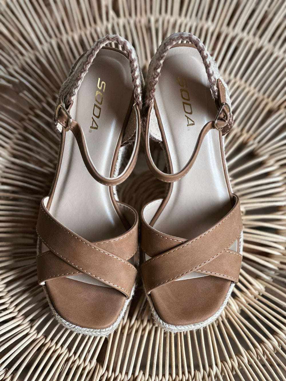 Top view of brown 4 inch wedge sandals, with a woven rapped midsole and an adjustable strap 