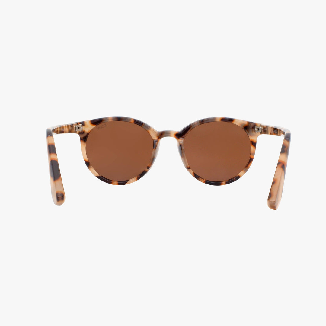 Sunglasses with tortoiseshell frame and brown lenses on a white background