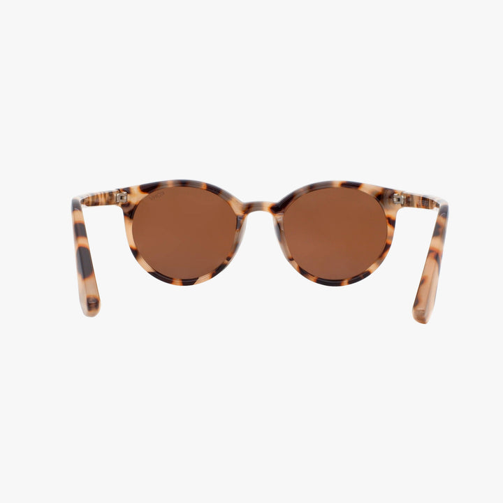 Sunglasses with tortoiseshell frame and brown lenses on a white background