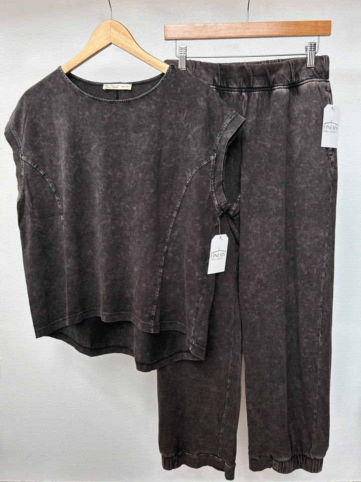 Top and bottom front view of relaxed, oversized fit with dropped shoulders top and matching bottoms mineral washed