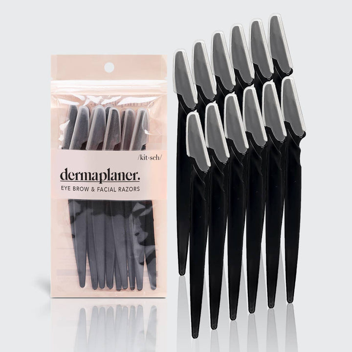 Set of black razors with packaging labeled 'dermaplaner' on a white background