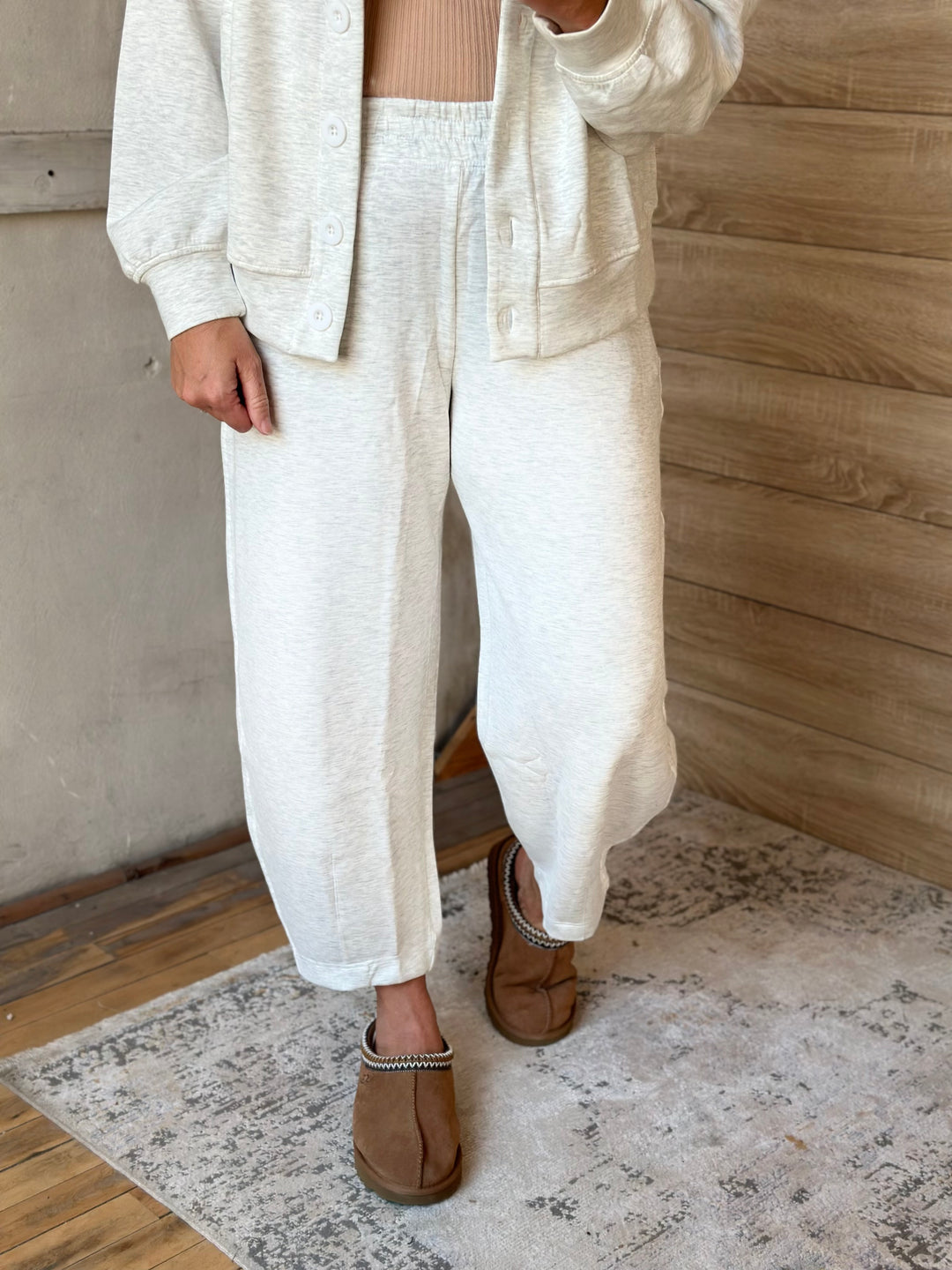 Cream barrel-leg pants showing the curved leg shape