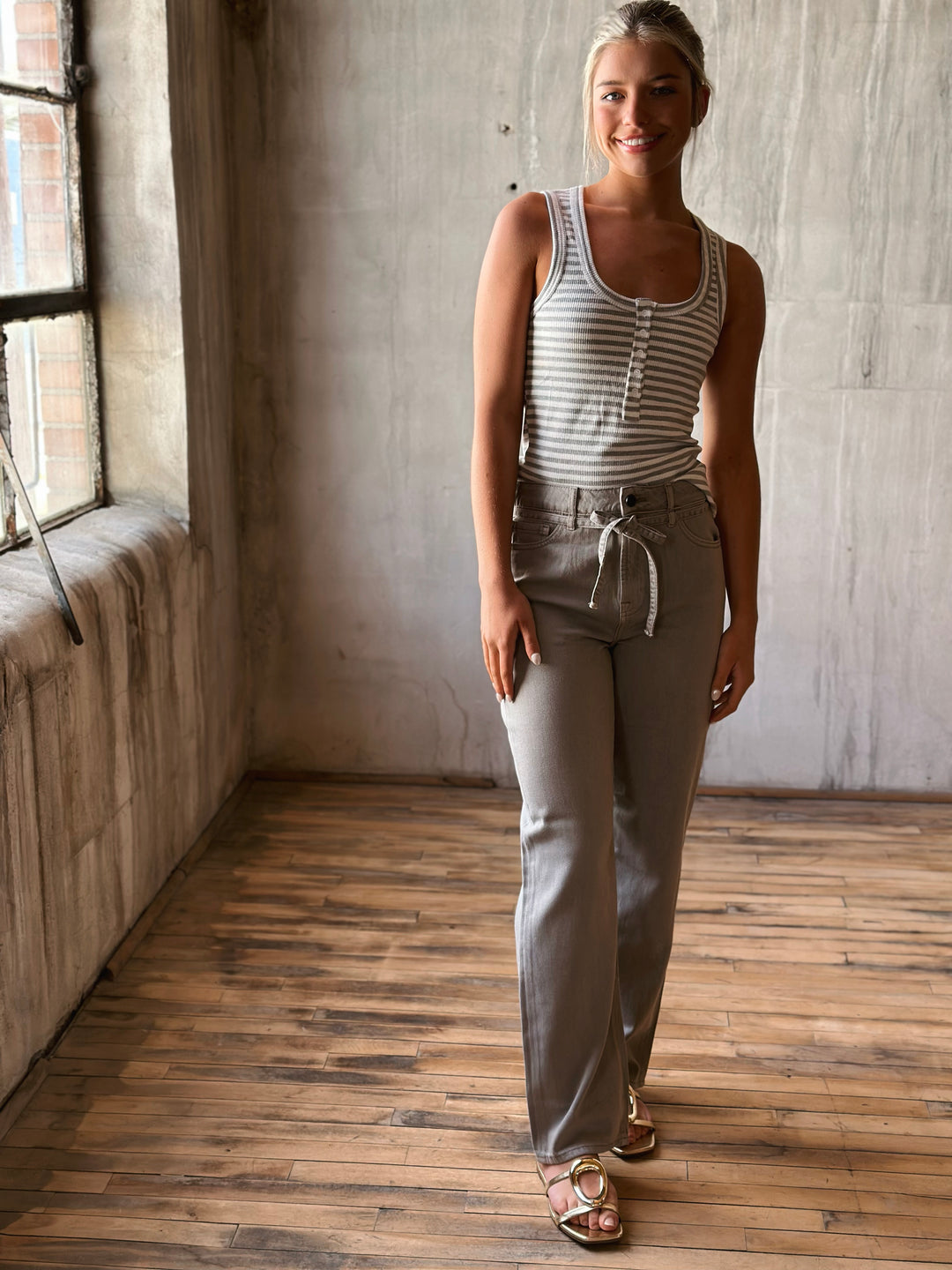 Front of High Rise Wide Straight Jeans with Removable Belt paired with stripe tank top