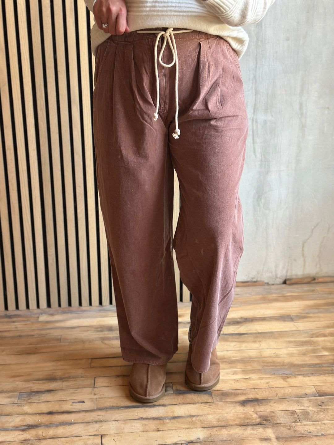 Dusty rose wide-leg pants with a tie drawstring waist, front view
