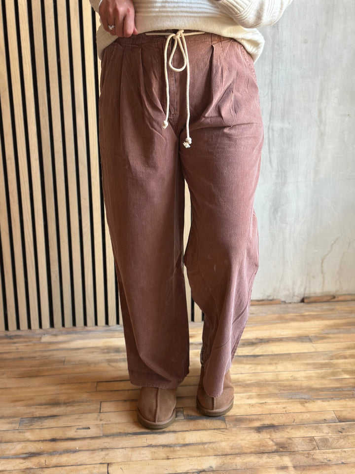 Dusty rose wide-leg pants with a tie drawstring waist, front view