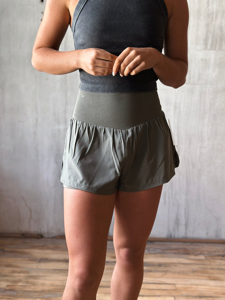 Front view Air Flow Ribbed Waist Athletic Shorts – in moss