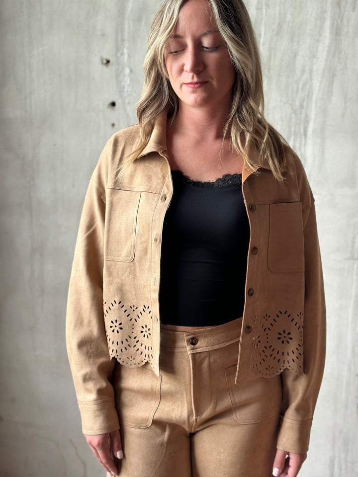 Tan suede-look shirt jacket worn open over a black tank, front view