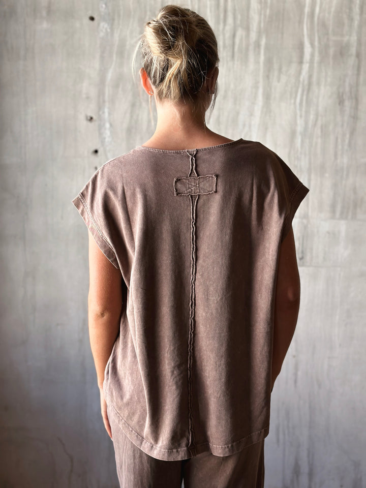 back view of relaxed, oversized fit with dropped shoulders and a high-low hem. mineral washed in mocha
