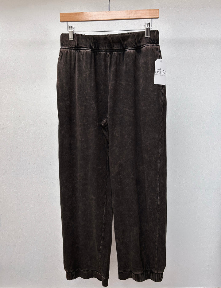 front view mineral washed pants ankle length are paired with an elastic waistband and half-cinched hem in black