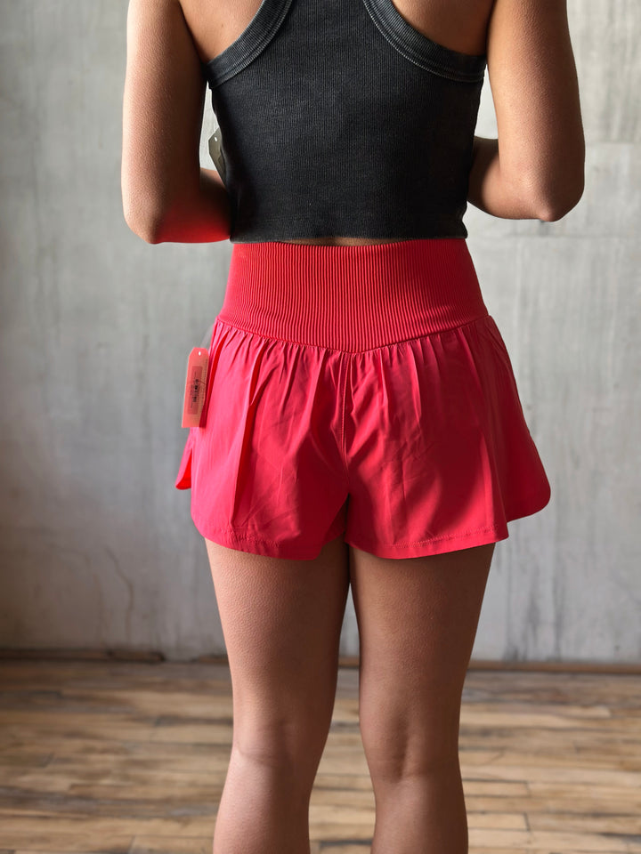 back view Air Flow Ribbed Waist Athletic Shorts – in Coral