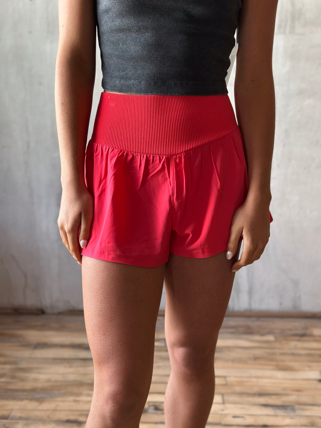 Front view Air Flow Ribbed Waist Athletic Shorts – in Coral