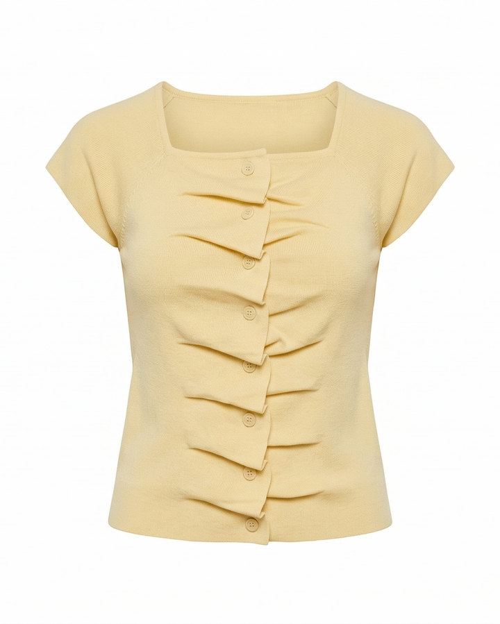Yellow blouse with ruffled details on a white background
