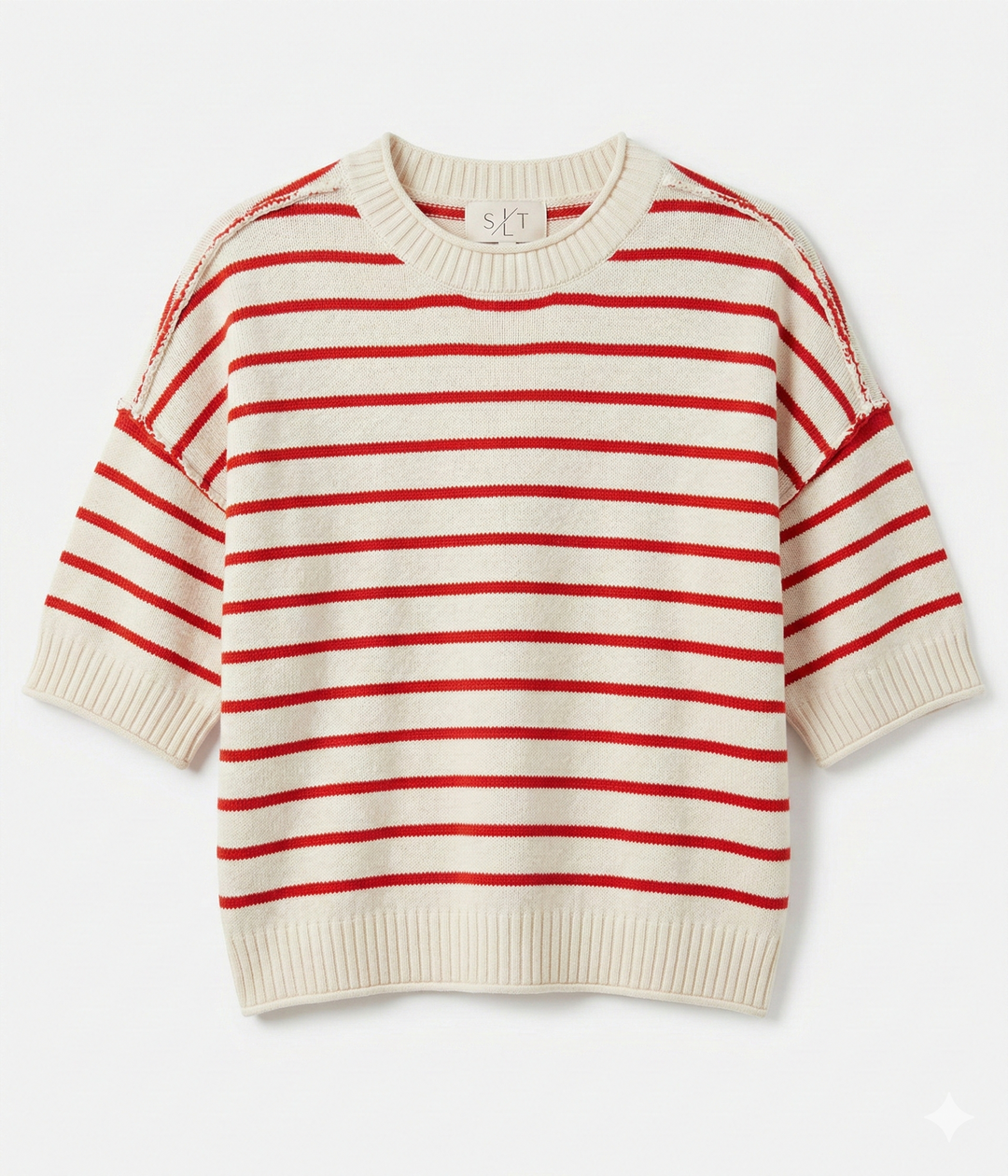 Red and white striped sweater on a light beige background